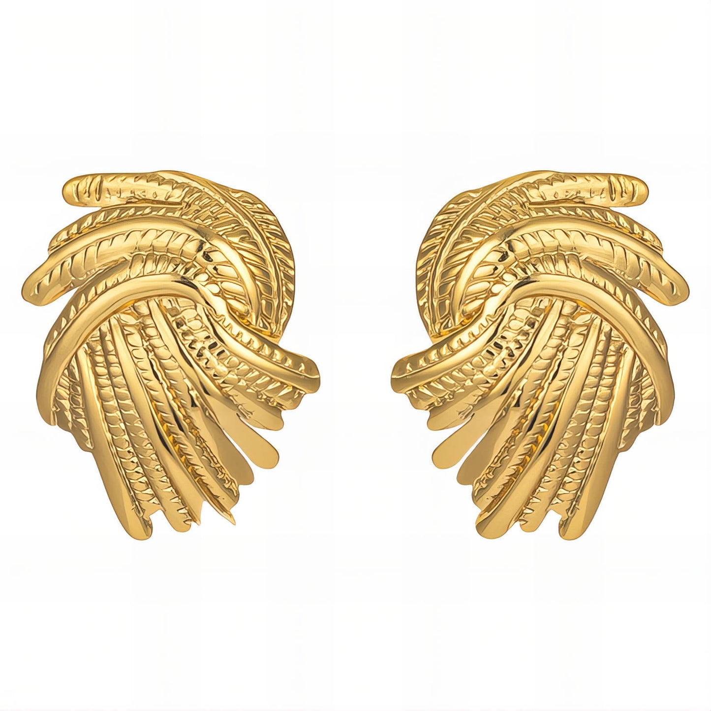 Pair of gold earrings on a white background